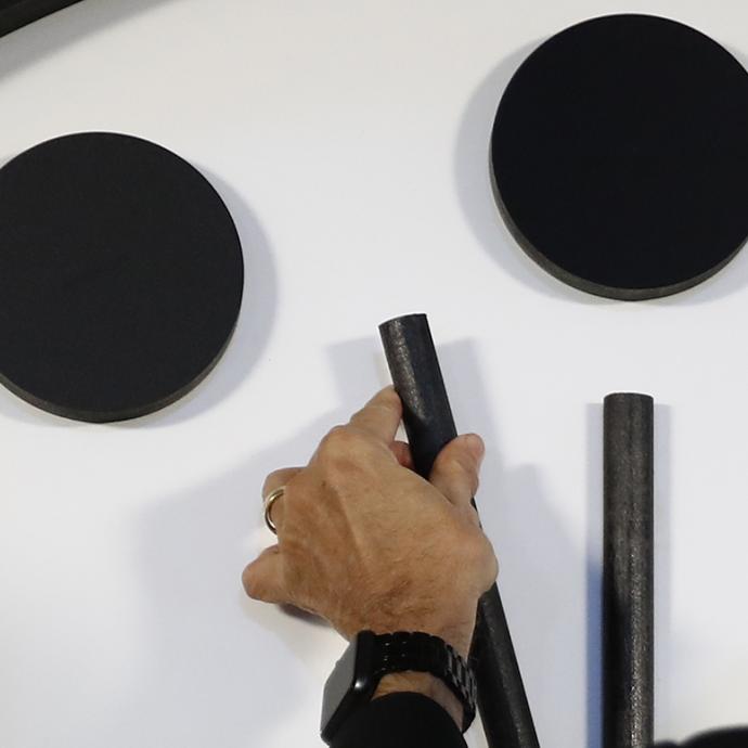 Hand moving the Doomsday Clock